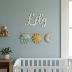 Custom-made wooden name sign and felt banners for nursery handmade wall decor.