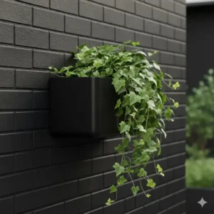 A minimalist black metal outdoor wall basket mounted on a dark brick wall.