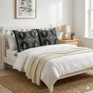 Illustration 2: Modern bedroom interior featuring two decorative black boho pillow sets on a white bed.