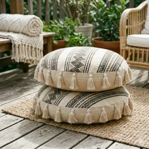 Weather-resistant boho floor cushions arranged on a wooden deck for stylish outdoor lounging.