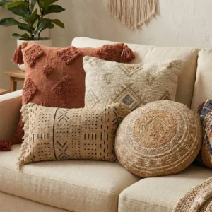 Detailed illustration of handmade macramé boho throw pillows for a couch covers placed on a neutral fabric sectional.