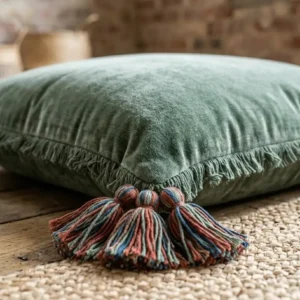Detailed view of the tassels and macrame fringe on the edges of handcrafted boho floor pillows.