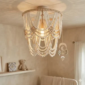 A white wood-beaded chandelier installed in a bright nursery for elegant boho lighting.