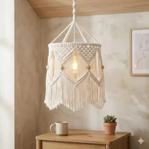 White macrame bohemian pendant light with hanging fringe and wooden bead accents.