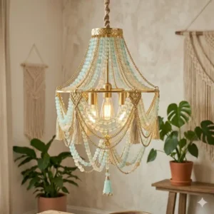 Elegant boho chandelier featuring gold brass hardware and layered sea-glass beads.