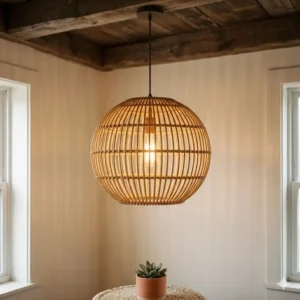 Pair of small bohemian hanging lights used as bedside lamps in a minimalist boho-chic bedroom.