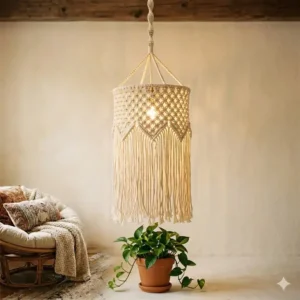 Cream-colored handmade macrame bohemian hanging lights with long cotton fringe and decorative knots.