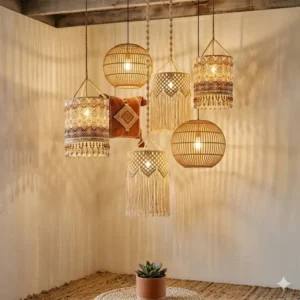 Three oversized bohemian hanging lights in varying shapes suspended over a rustic wooden dining table.
